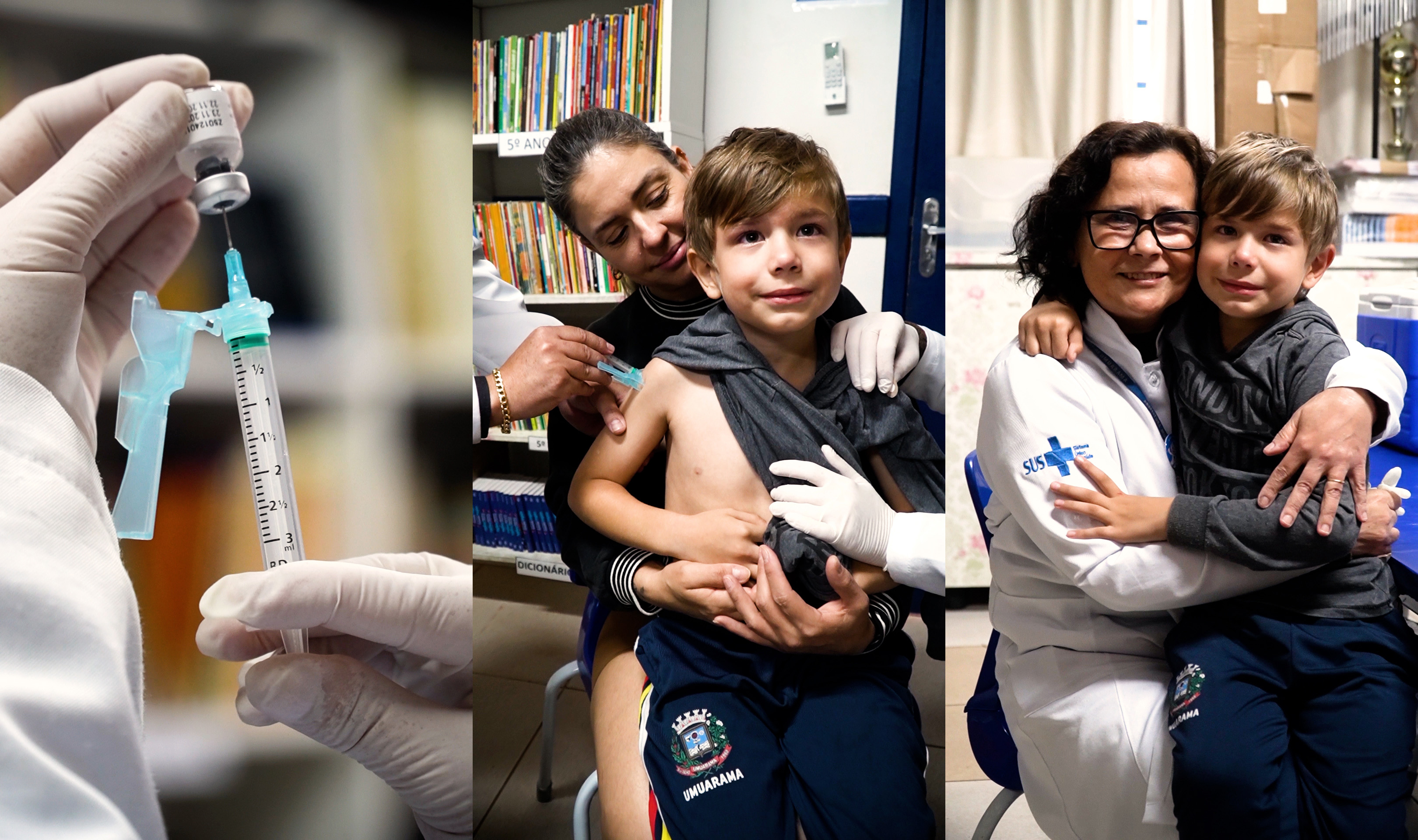 criança recebe vacina no braço, no colo da mãe